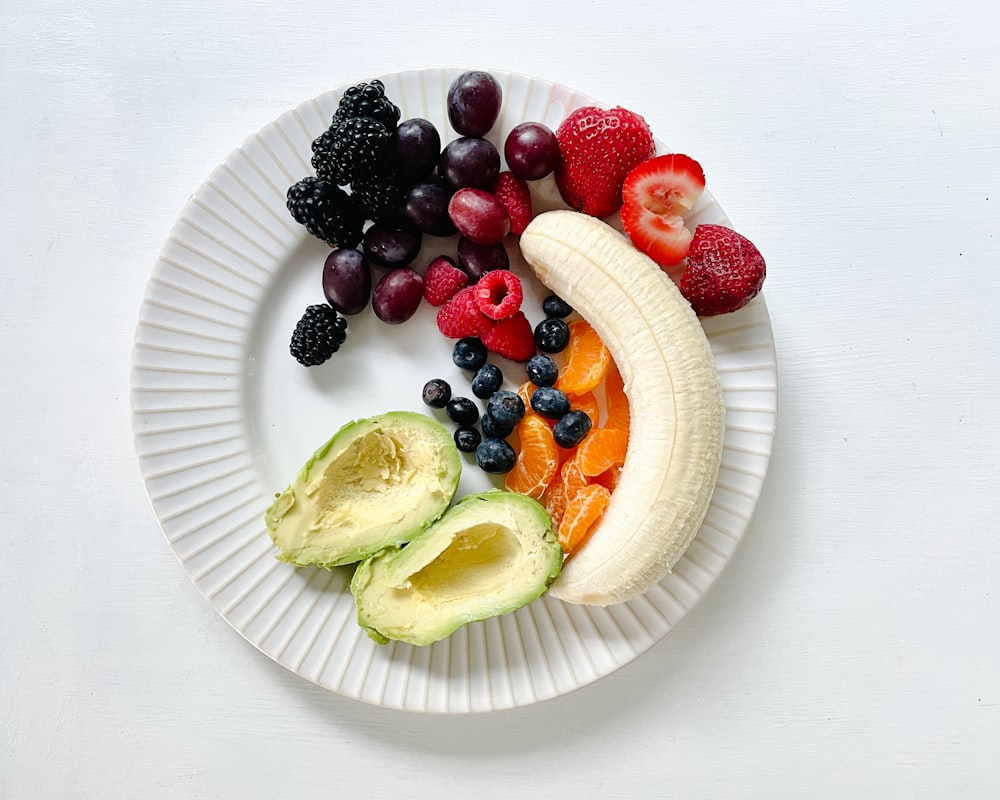 Person preparing healthy balanced meal with vegetables and proteins